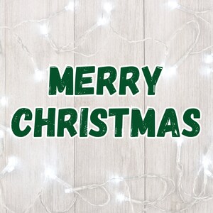 May include: White Christmas lights strung on a woodgrain background with the text "Merry Christmas" in green.