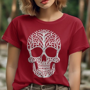 May include: A red t-shirt with a white skull design. The skull is made up of branches and leaves.