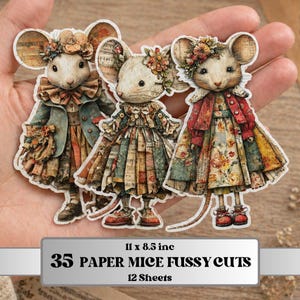 Puede incluir: Tres recortes de papel de ratones vestidos con ropa vintage. Cada ratón tiene orejas grandes y lleva una corona floral. Los ratones visten vestidos y abrigos en tonos azules, rojos y marrones. El texto de la imagen dice "35 Paper Mice Fussy Cuts".