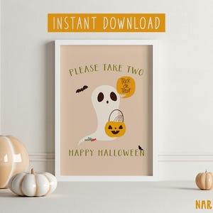 May include: A printable Halloween sign featuring a friendly ghost holding a trick-or-treat bag. The sign says "Please take two" and "Happy Halloween".
