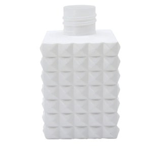 May include: White plastic bottle with a textured, diamond-shaped pattern. The bottle has a white cap.