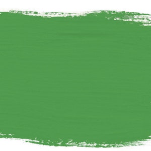 May include: A solid green painted swatch with a rough, textured brushstroke border.