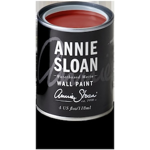 May include: A small can of Annie Sloan Chalk Paint in a deep red color. The can is labeled "Annie Sloan Waterbased Matte Wall Paint" and has the company logo and "4 US fl oz/118ml" printed on the bottom.