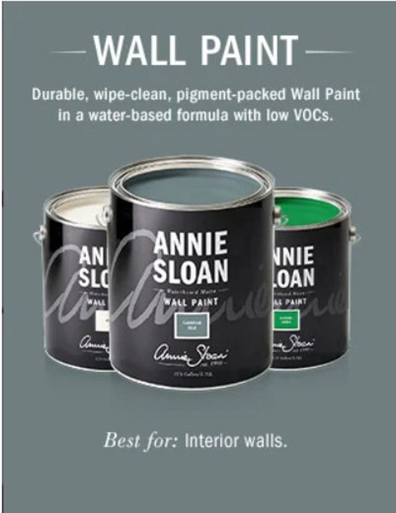 May include: Three cans of Annie Sloan Wall Paint. The cans are labeled with the brand name and the color of the paint. The colors are green, blue, and white. The text on the cans reads "Annie Sloan Wall Paint".