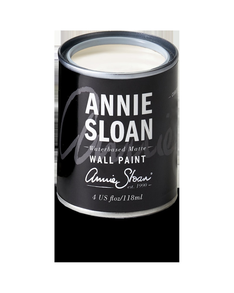 May include: A white, water-based matte wall paint in a 4 US fl oz / 118 ml can. The can is black with white text that reads "Annie Sloan - Waterbased Matte - WALL PAINT - Annie Sloan est. 1990 - 4 US fl oz / 118 ml".