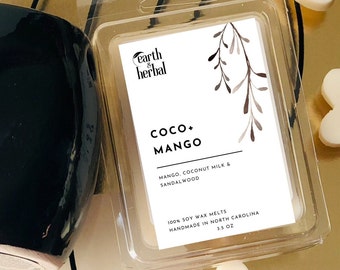 May include: A clear plastic container with a white label that reads "earth & herbal COCO+ MANGO MANGO, COCONUT MILK & SANDALWOOD 100% SOY WAX MELTS HANDMADE IN NORTH CAROLINA 3.5 OZ".