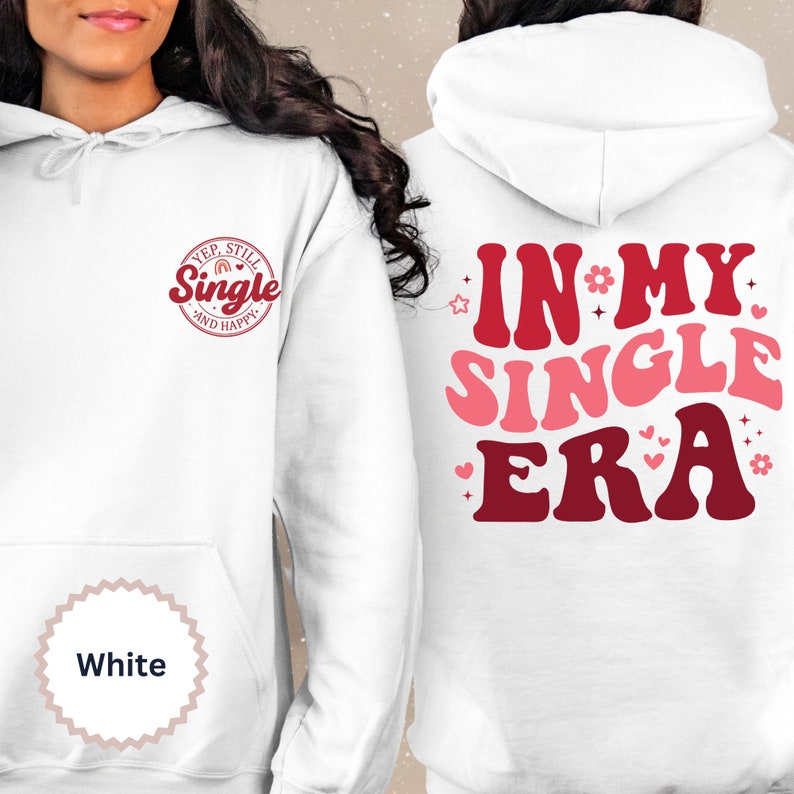 May include: White hoodie with the text "Yep, Still Single and Happy" in a red circle on the front and "In My Single Era" in pink and red letters on the back.