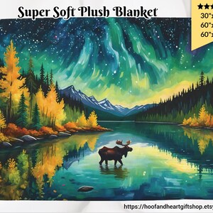 May include: A plush blanket featuring a painting of a lake with a moose standing in the water. The lake is surrounded by trees and mountains. The sky is a vibrant green and blue with stars and a green aurora borealis. The blanket is available in three sizes: 30"x40", 60"x50", and 60"x80".