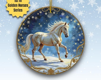 May include: A round ceramic ornament featuring a white horse with a flowing mane and tail, set against a starry blue background. The ornament has a gold border and a gold string for hanging. Text on the ornament reads "1st in Golden Horses Series".