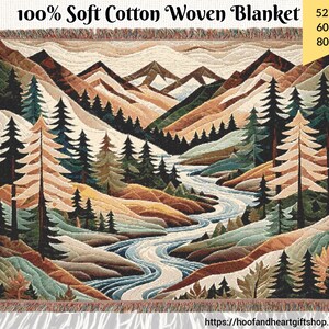 May include: A woven cotton throw blanket featuring a colorful landscape scene with mountains, a river, and trees. The blanket is available in three sizes: 52 inches by 37 inches, 60 inches by 50 inches, and 80 inches by 60 inches.