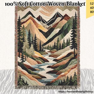 May include: A woven cotton throw blanket featuring a colourful mountain landscape with a river flowing through it. The blanket is available in three sizes: 52 inches by 37 inches, 60 inches by 50 inches, and 80 inches by 60 inches.