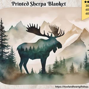 May include: A printed sherpa blanket featuring a silhouette of a moose standing in a forest with mountains in the background. The blanket is available in three sizes: 30"x40", 60"x50", and 60"x80".