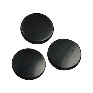 May include: Three black round smooth stones, each about 2 inches in diameter.