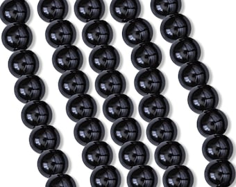 May include: A strand of black round beads, arranged in rows, with a glossy finish.