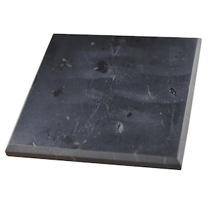 May include: A square black slate tile with a smooth surface and a slightly rough texture. The tile has a natural, rustic look with subtle white and gray veining.