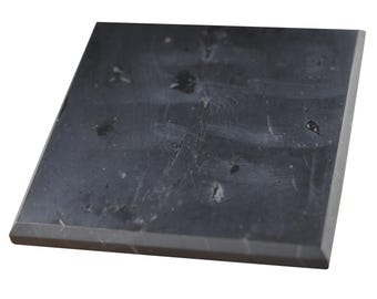 May include: A square black slate tile with a smooth surface and a slightly rough texture. The tile has a natural, rustic look with subtle white and gray veining.