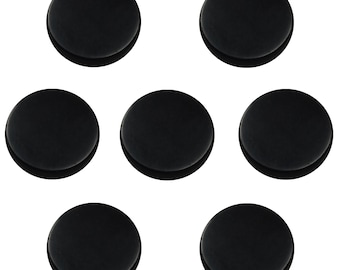 May include: Six black round felt pads, likely for furniture or other objects, to prevent scratching.