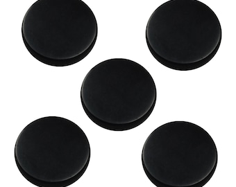 May include: Five black round felt pads, likely for furniture or other objects, to prevent scratching.