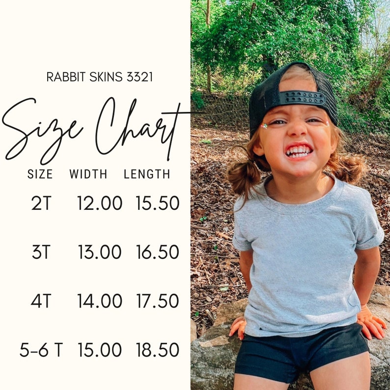 May include: A child wearing a gray t-shirt and black shorts smiles, with a black cap. A size chart displays measurements for children's t-shirts, including width and length in inches, for sizes 2T to 5-6T. The text "RABBIT SKINS 3321" is at the top.