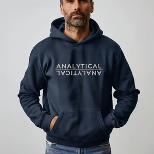 May include: A navy blue hooded sweatshirt with the word "ANALYTICAL" printed in white on the front, with the word reversed underneath.