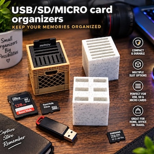 May include: Three square organizers for USB, SD, and micro SD cards. One organizer is tan and resembles a miniature crate, while two are white with a speckled texture. Each features multiple slots for storage, accompanied by various memory cards and a USB drive.
