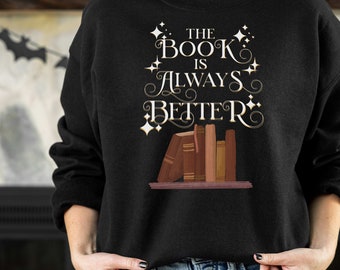May include: Black sweatshirt with a white graphic that says "The Book Is Always Better" with a stack of books and stars.