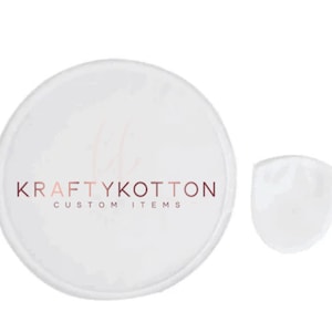 May include: White round sticker with the text "KraftyKOTTON CUSTOM ITEMS" in pink and brown lettering.