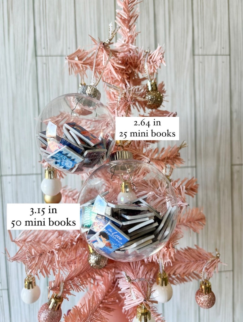 May include: Two clear glass ornaments filled with miniature books. The larger ornament is 3.15 inches in diameter and holds 50 mini books. The smaller ornament is 2.64 inches in diameter and holds 25 mini books. Both ornaments are hanging on a pink artificial Christmas tree.