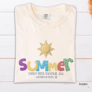 May include: Ivory-colored t-shirt with the word "Summer" in colorful, patchwork letters and a gingham sun graphic. Below, text reads "Family Smith Vacation, 2026, Wilmington Beach, NC."