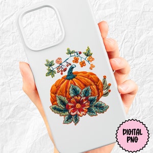 Peut inclure: Citrouille brod&eacute;e avec des feuilles vertes et une fleur rouge. La citrouille est orange et a une tige. Le motif est parfait pour la d&eacute;coration d'automne.
