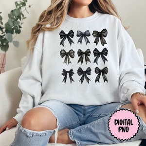 May include: A white sweatshirt with a design of twelve black watercolor bows.