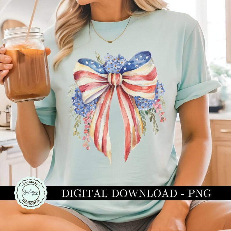 May include: A light blue t-shirt with a watercolor design of a red, white, and blue bow with flowers. The bow is made to look like the American flag. The text "DIGITAL DOWNLOAD - PNG" is at the bottom of the image.