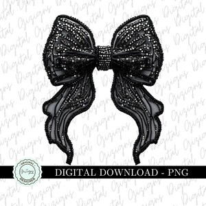 May include: A black bow with a sparkly, textured design. The bow is made of fabric and has a large, central knot.