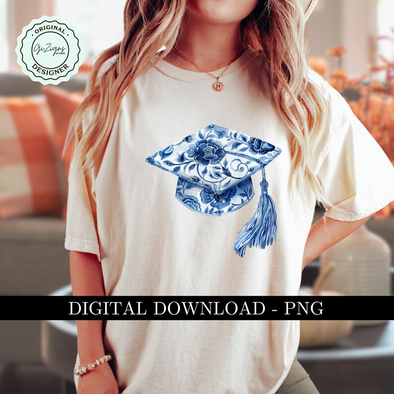 May include: A white t-shirt with a blue and white floral graduation cap design. The cap has a tassel and is centered on the shirt. The text "DIGITAL DOWNLOAD - PNG" is at the bottom of the image.