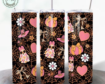May include: Three stainless steel tumblers with a black and orange spiderweb pattern. The pattern also includes pink ghosts, pumpkins, bows, and flowers.