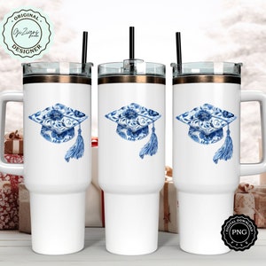 May include: Three white stainless steel tumblers with lids and straws. Each tumbler features a blue and white watercolor graduation cap design.