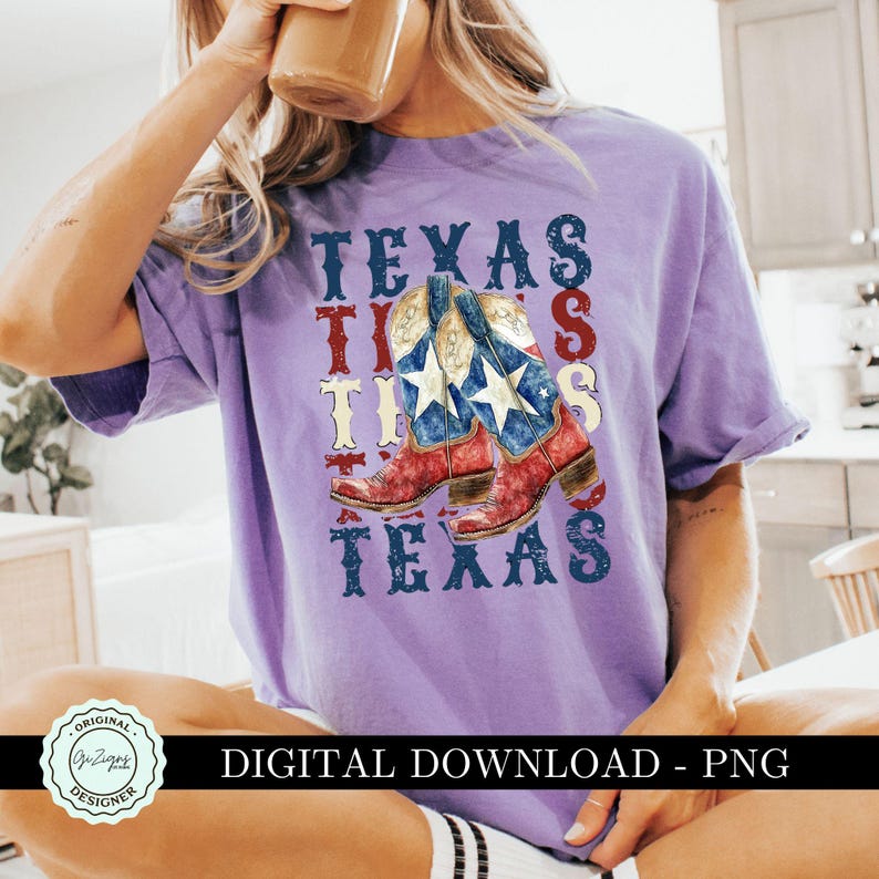 May include: Purple t-shirt with a graphic design of cowboy boots with an American flag pattern and the word "TEXAS" repeated four times.