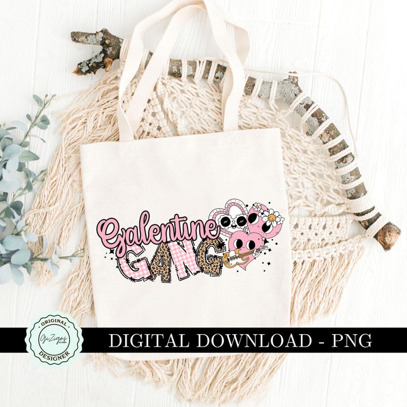 May include: A white tote bag with the text "Galentine Gang" in pink and black letters with a pink and white checkered pattern. The text is surrounded by pink hearts with cartoon eyes and a guitar.
