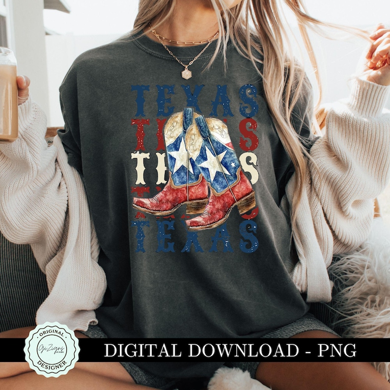 May include: A dark gray t-shirt with a graphic design of cowboy boots with a Texas flag pattern. The text "Texas This Texas" is printed on the shirt.