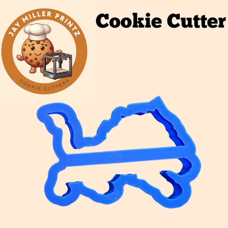 May include: Blue plastic cookie cutter shaped like a turtle. The cutter is designed to cut out a turtle shape from cookie dough.
