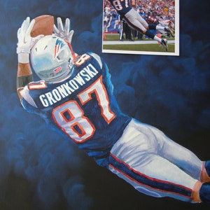 May include: An oil painting of a football player in a blue and white uniform, catching a football. The player's jersey displays the name "GRONKOWSKI" and the number "87". The background is a dark blue with lighter blue brushstrokes.