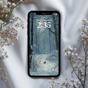 May include: A smartphone displaying a winter forest scene with a red cardinal bird on a snowy path. The time is 2:35 and the date is Thursday, January 25.