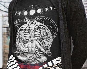 May include: Black t-shirt with a white graphic of a winged goat with horns, sitting in a meditative pose. The graphic is surrounded by a circle with astrological symbols and the text "12:00 9:00 0:00".