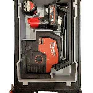 May include: A black hard case with a red and black Milwaukee laser level and a red and black Milwaukee battery inside. The case has a latch on the side.