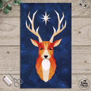 May include: A geometric deer head design with antlers and a star against a dark blue backdrop. The deer is made of orange, red, and white shapes. The image is a pattern from Easy Piece Patterns.