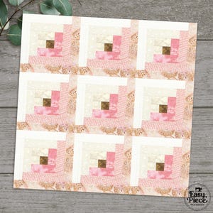 May include: A quilt pattern with nine log cabin blocks. Each block features a central square of brown fabric, surrounded by strips of pink, cream, and white fabric. The background is a pink paisley print.