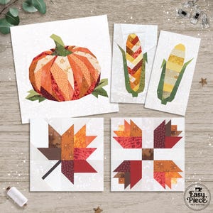 Puede incluir: Un conjunto de bloques de arte textil con diseños otoñales. Los bloques incluyen una calabaza, dos mazorcas de maíz y dos hojas de arce, en tonos naranja, rojo y marrón. Los diseños están sobre un fondo blanco.