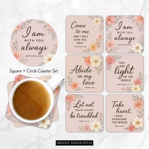 May include: A coaster set with a floral design and inspirational quotes. The set includes square and round coasters with quotes like "I am with you always" and "Come to me". A cup of coffee sits on one of the coasters.