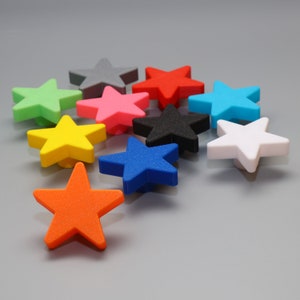 May include: Assortment of ten star-shaped drawer pulls in various colours, including red, blue, green, yellow, pink, white, grey, and black.