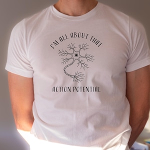 May include: White t-shirt with a black and white illustration of a neuron and the text "I'm all about that action potential".